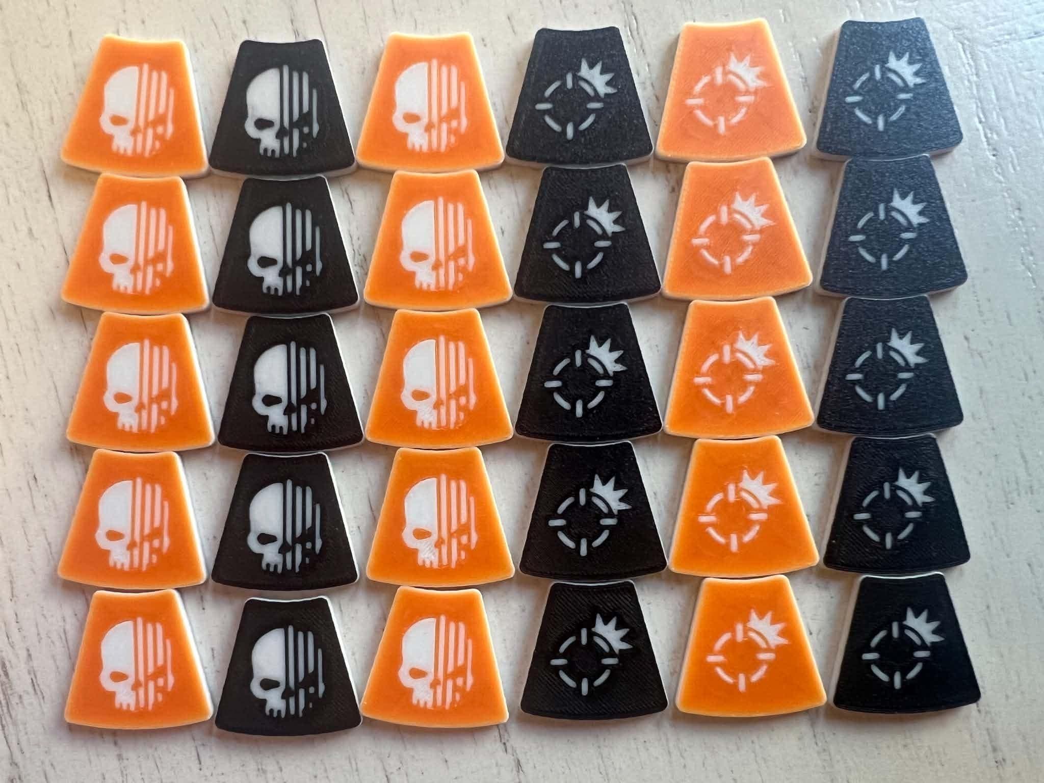 Thirty trapezoid tokens in rows: orange and black, half with a skull icon and half with a target icon.
